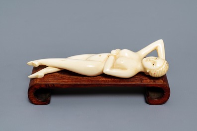 A Chinese ivory model of a doctor's lady, 19th C.