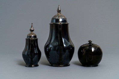 Two silver-mounted Namur black-glazed pottery jugs and a teapot, 18th C.