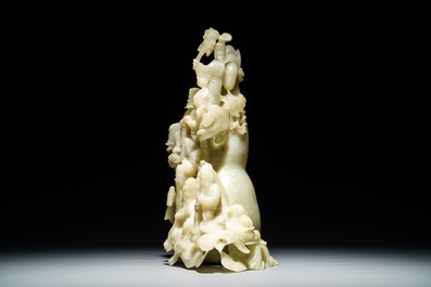 A Chinese pale green jade 'immortals' vase, 20th C.