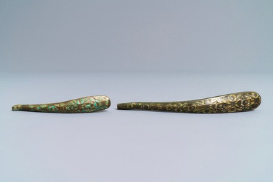 Two Chinese inlaid bronze belt hooks and a bronze ornament, Zhou or Han