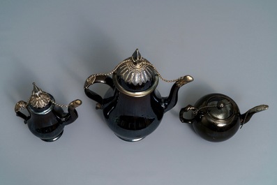 Two silver-mounted Namur black-glazed pottery jugs and a teapot, 18th C.