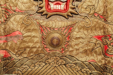 A pair of large Chinese relief-embroidered silk 'dragon' panels, 19th C.