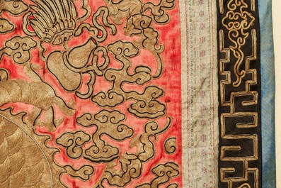 A pair of large Chinese relief-embroidered silk 'dragon' panels, 19th C.