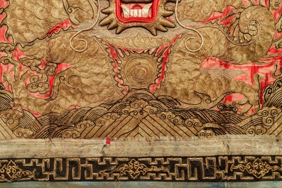 A pair of large Chinese relief-embroidered silk 'dragon' panels, 19th C.
