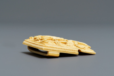 A Chinese ivory 'dragon' belt buckle, Wanli