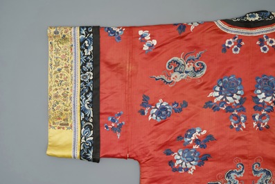 A Chinese woman's embroidered red silk side-opening informal coat, 19th C.
