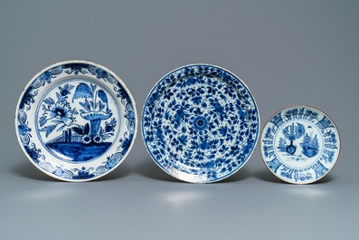 A Dutch Delft blue and white tobacco jar, a jug and three dishes, 18th C.