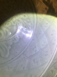 A Chinese Longquan celadon dish with underglaze design of peonies, Ming