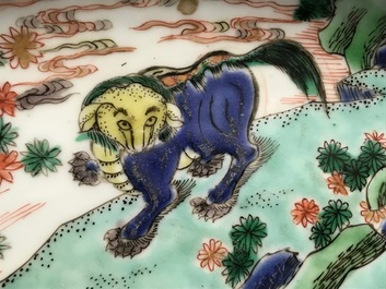 A pair of Chinese famille verte 'mythical beasts' chargers, Kangxi