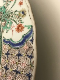 A pair of Chinese famille verte 'mythical beasts' chargers, Kangxi