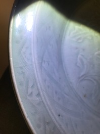 A Chinese Longquan celadon dish with underglaze design of peonies, Ming