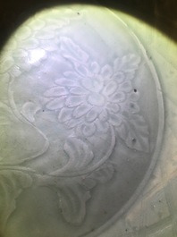 A Chinese Longquan celadon dish with underglaze design of peonies, Ming