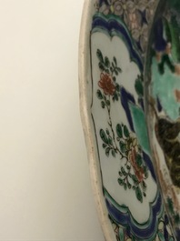 A pair of Chinese famille verte 'mythical beasts' chargers, Kangxi