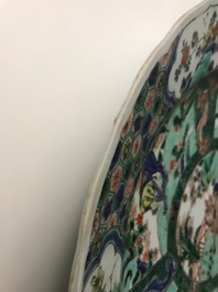 A pair of Chinese famille verte 'mythical beasts' chargers, Kangxi