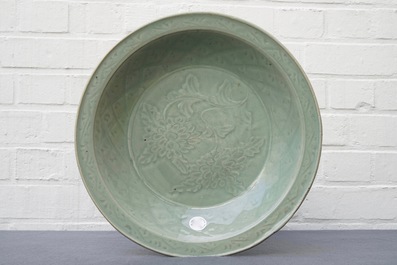 A Chinese Longquan celadon dish with underglaze design of peonies, Ming