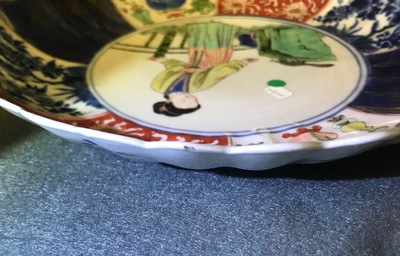 A Chinese verte-Imari 'lady and squirrel' plate, Kangxi