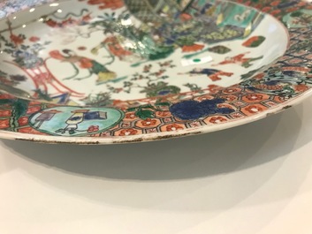 A fine Chinese famille verte dish with ladies in a garden, Kangxi