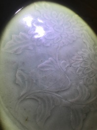 A Chinese Longquan celadon dish with underglaze design of peonies, Ming