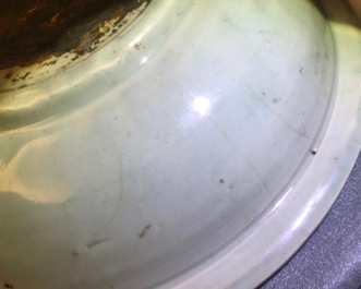 A Chinese Longquan celadon dish with underglaze design of peonies, Ming