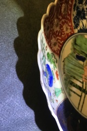 A Chinese verte-Imari 'lady and squirrel' plate, Kangxi