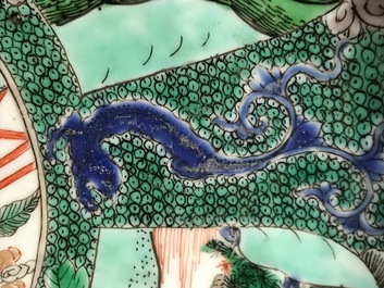A pair of Chinese famille verte 'mythical beasts' chargers, Kangxi