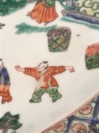 A fine Chinese famille verte dish with ladies in a garden, Kangxi