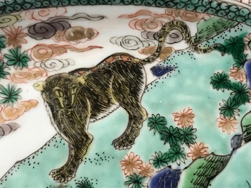A pair of Chinese famille verte 'mythical beasts' chargers, Kangxi