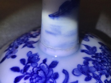 A pair of Chinese blue and white candlesticks, Kangxi/Qianlong