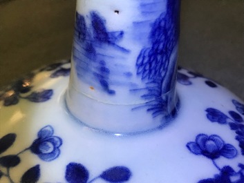 A pair of Chinese blue and white candlesticks, Kangxi/Qianlong