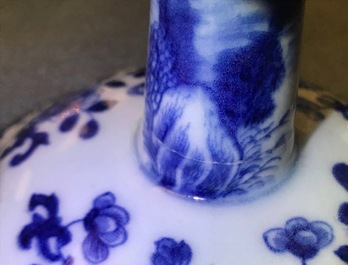 A pair of Chinese blue and white candlesticks, Kangxi/Qianlong