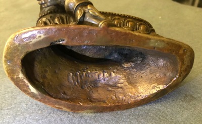 A Sino-Tibetan bronze figure of Jambhala, 17/18th C.