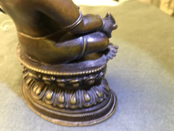 A Sino-Tibetan bronze figure of Jambhala, 17/18th C.