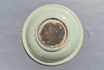 A Chinese Longquan celadon dish with underglaze design of peonies, Ming