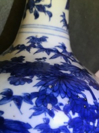 A Chinese blue and white bottle vase with birds in a landscape, Wanli