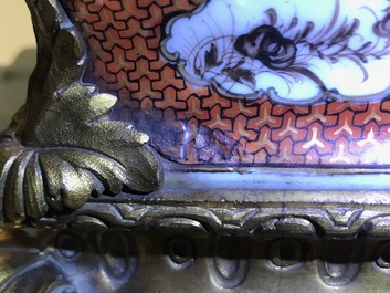 A pair of large Chinese ormolu-mounted famille rose 'mandarin' vases and covers, Qianlong