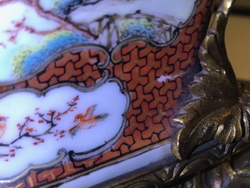 A pair of large Chinese ormolu-mounted famille rose 'mandarin' vases and covers, Qianlong