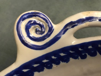 A large blue and manganese Frisian Delft fish strainer, Tichelaar, Makkum, 19th C.