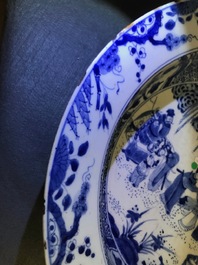 A pair of Chinese blue and white basins with figures in a garden, Yongzheng