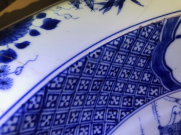 A pair of Chinese blue and white basins with figures in a garden, Yongzheng