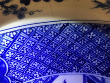 A pair of Chinese blue and white basins with figures in a garden, Yongzheng