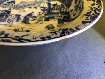 A pair of Chinese blue and white basins with figures in a garden, Yongzheng