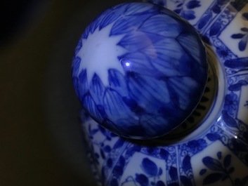 A large Chinese blue and white baluster jar and cover with floral panels, Kangxi