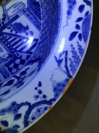 A pair of Chinese blue and white basins with figures in a garden, Yongzheng