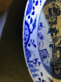 A pair of Chinese blue and white basins with figures in a garden, Yongzheng