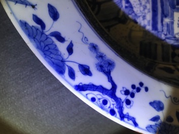A pair of Chinese blue and white basins with figures in a garden, Yongzheng