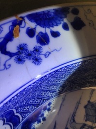 A pair of Chinese blue and white basins with figures in a garden, Yongzheng