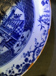 A pair of Chinese blue and white basins with figures in a garden, Yongzheng