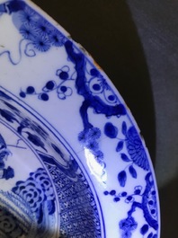 A pair of Chinese blue and white basins with figures in a garden, Yongzheng