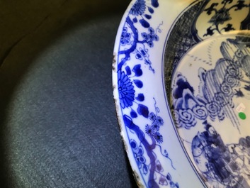 A pair of Chinese blue and white basins with figures in a garden, Yongzheng