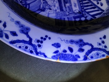 A pair of Chinese blue and white basins with figures in a garden, Yongzheng